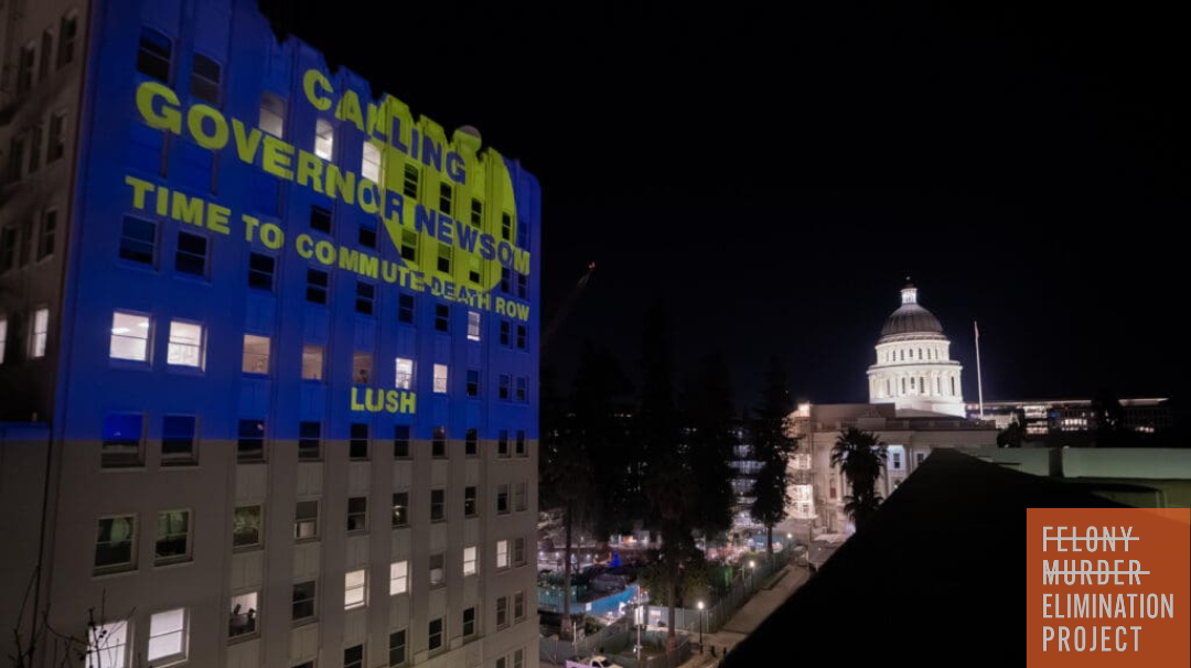 Lush Cosmetics projects a message on a building near the California Capitol building in Sacramento; "Calling Governor Newsom; time to commute death row."