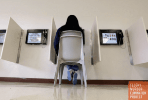A woman communicates with her incarcerated husband at the Wende Correctional Facility in Alden, New York (AP Photo)