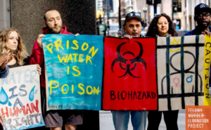 Advocates gather outside the EPA Region 5 office in Chicago after delivering a petition urging the agency to address unsafe drinking water conditions in Illinois state prisons. (Photo: David Moran/Associated Press)