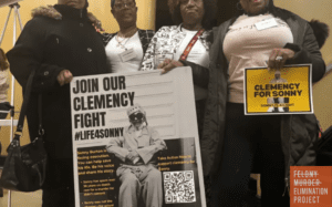 (L to R) Eddie Mae Ellison, Jackie Bradford, Mary Bradford and Lois Harris hold signs on Jan. 28, 2026, in Montgomery, Ala., urging Alabama Gov. Kay Ivey to grant clemency for their family member Charles “Sonny” Burton. (Kim Chandler/Associated Press)
